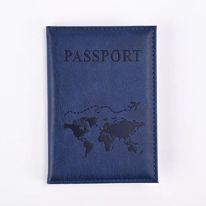 Navy blue AeroVault passport wallet with embossed travel route and airplane icon